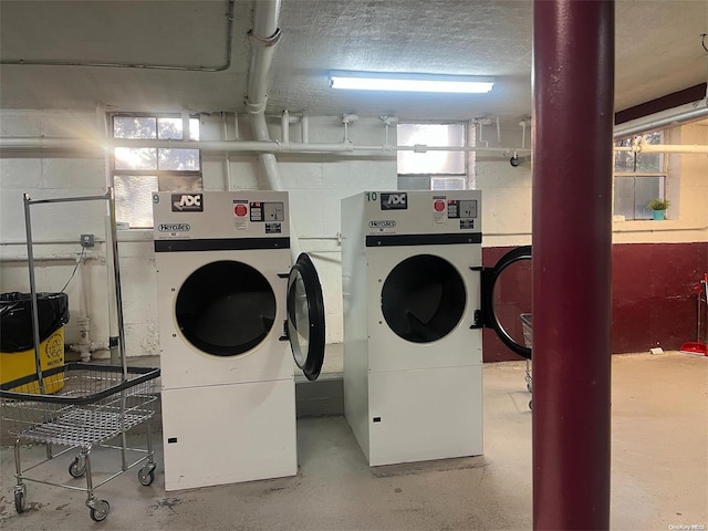 laundry area with washing machine and dryer