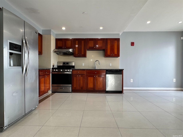 kitchen featuring light tile patterned flooring, sink, and appliances with stainless steel finishes