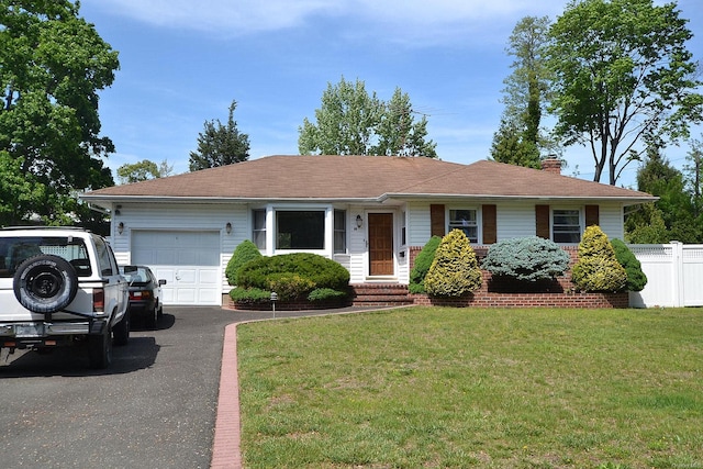 60 Tanglewood Dr, Smithtown, NY 11787 - ranch-style home with an attached garage, a chimney, and asphalt driveway