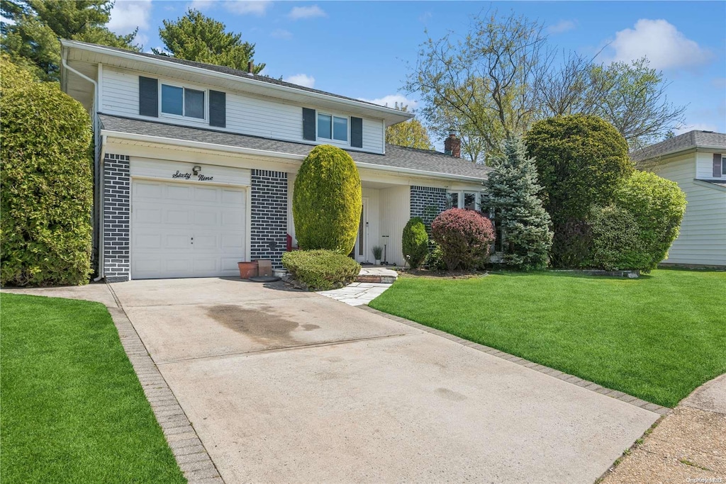 69 Sunnyside Ln, Oyster Bay, NY 11590 - traditional-style home with driveway, an attached garage, a chimney, and a front yard