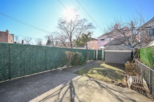 view of yard featuring a patio area and a shed