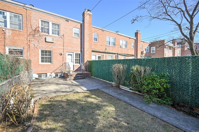 back of house with a patio area