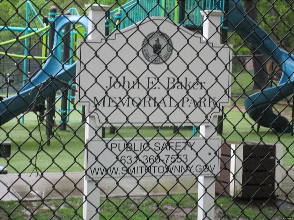 view of property's community featuring fence
