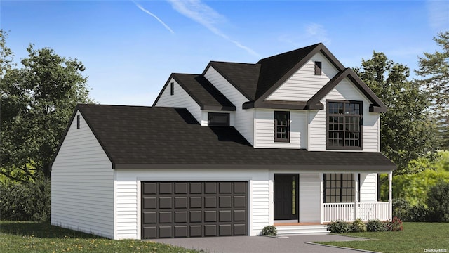 view of front of property with a garage, a porch, and a front yard