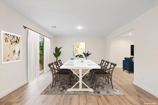 dining area featuring light wood-type flooring