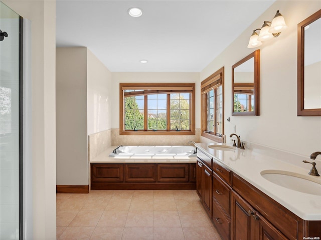 bathroom featuring tiled shower, a garden tub, tile patterned flooring, and a sink