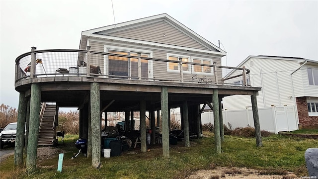 88 Bayview Ave, Lindenhurst, NY 11757 - rear view of house with stairs, a wooden deck, and a carport