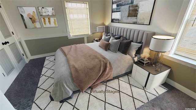 88 Bayview Ave, Lindenhurst, NY 11757 - bedroom featuring light tile patterned floors and baseboards