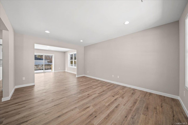 unfurnished living room with light hardwood / wood-style floors