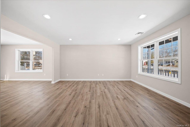 spare room featuring light hardwood / wood-style floors