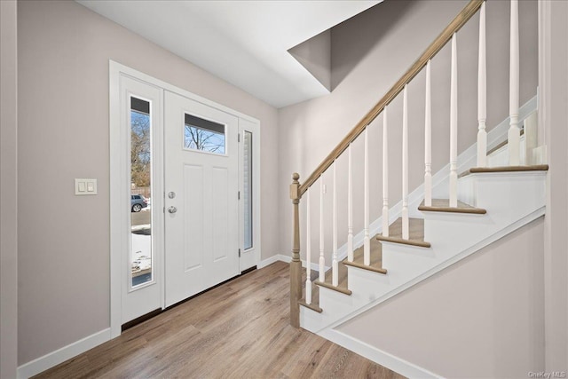 entrance foyer with light hardwood / wood-style flooring