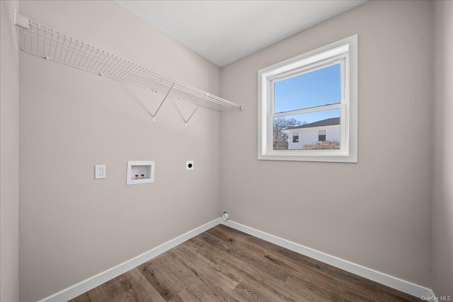 clothes washing area with hardwood / wood-style flooring, washer hookup, and electric dryer hookup