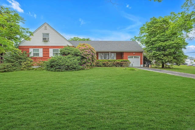 1519 Saint Louis Ave, Bay Shore, NY 11706 - view of front of home featuring an attached garage, driveway, and a front yard