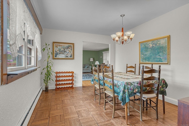 1519 Saint Louis Ave, Bay Shore, NY 11706 - dining room featuring a baseboard radiator, baseboards, and a chandelier