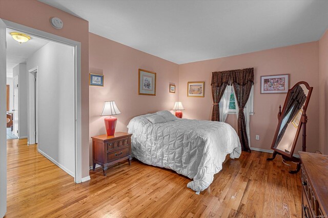 1519 Saint Louis Ave, Bay Shore, NY 11706 - bedroom featuring light wood-style flooring and baseboards