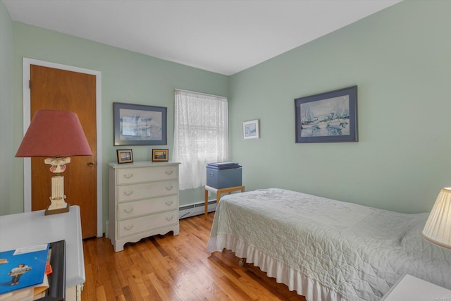 1519 Saint Louis Ave, Bay Shore, NY 11706 - bedroom with baseboard heating and wood finished floors