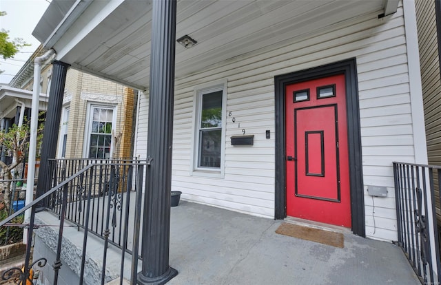 doorway to property featuring covered porch