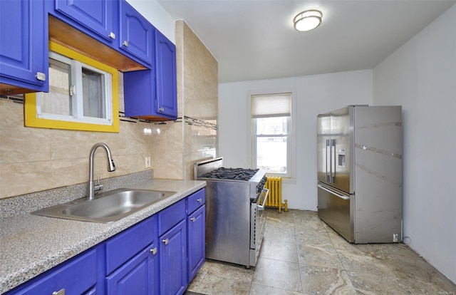 kitchen featuring stainless steel appliances, a sink, tasteful backsplash, blue cabinetry, and light countertops