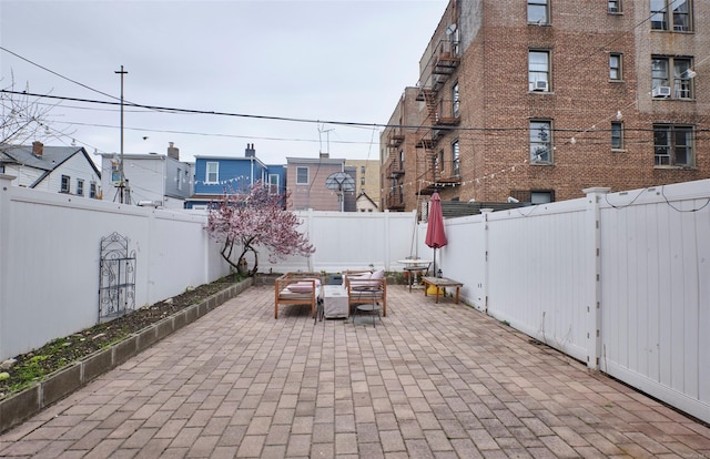view of patio / terrace featuring a fenced backyard and an outdoor living space