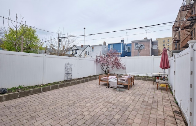 view of patio featuring a fenced backyard and an outdoor hangout area