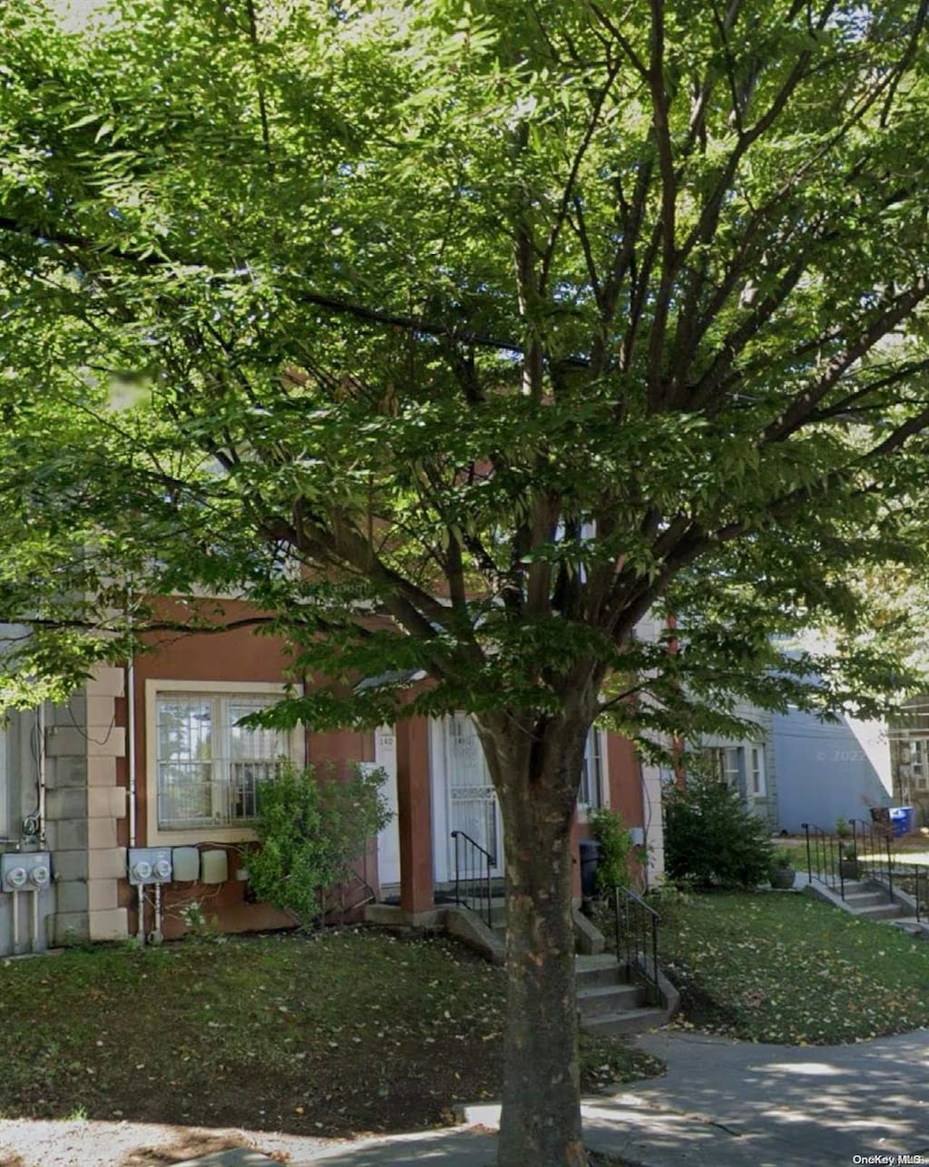 view of property hidden behind natural elements