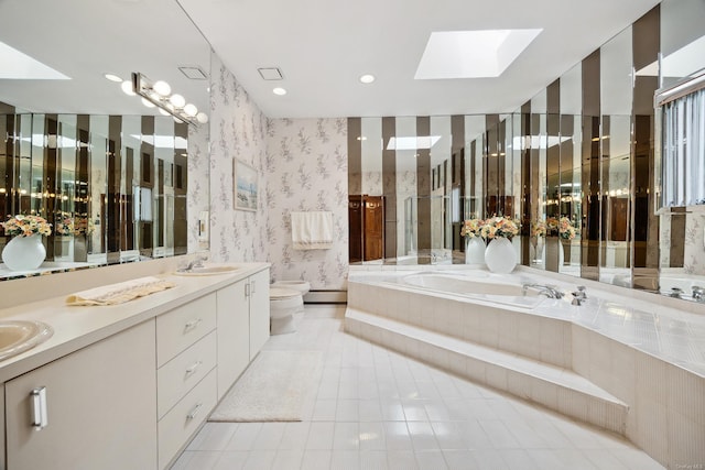 full bath with wallpapered walls, toilet, a bath, a skylight, and a sink