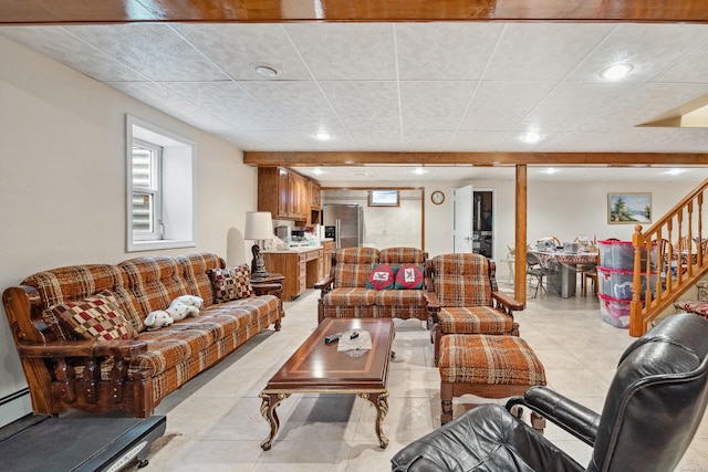 living area featuring stairs and light tile patterned flooring