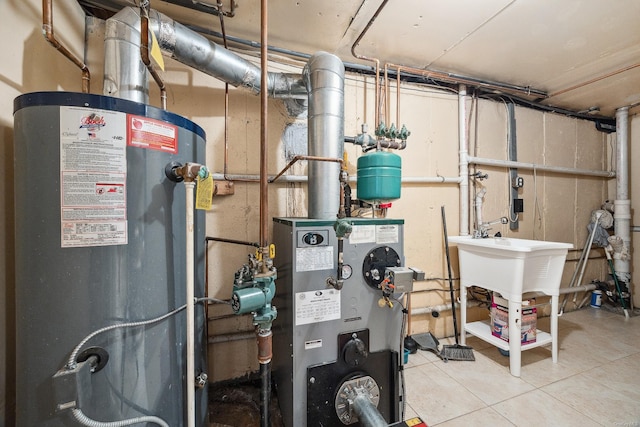 utility room featuring water heater