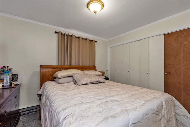 bedroom featuring carpet flooring, crown molding, and a closet