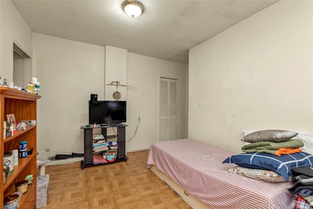 bedroom with light parquet floors