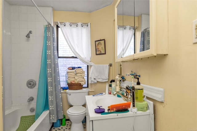 full bathroom with vanity, shower / bath combo, and toilet