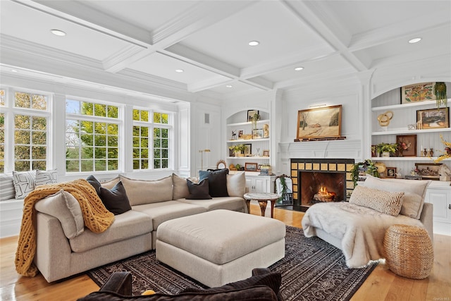 living room featuring beam ceiling, light hardwood / wood-style flooring, and coffered ceiling