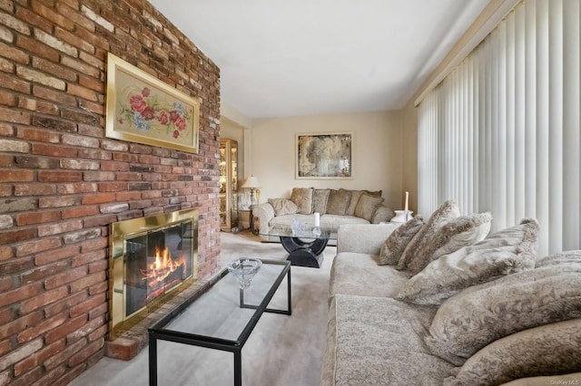 carpeted living room featuring a brick fireplace