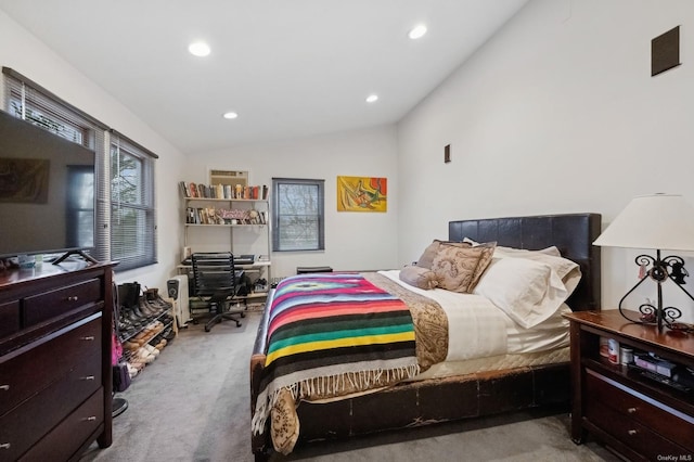 bedroom with light carpet and lofted ceiling