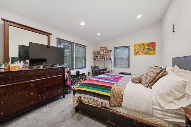 carpeted bedroom featuring lofted ceiling