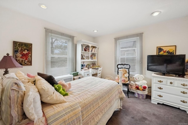 bedroom featuring dark colored carpet