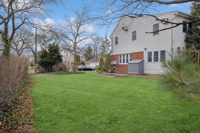 view of yard featuring a wall unit AC