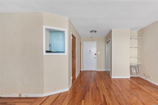 hall with light hardwood / wood-style floors