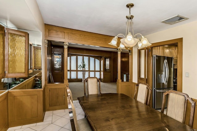 dining room with an inviting chandelier and light tile patterned floors