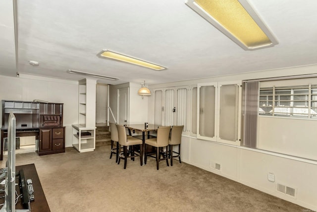 view of carpeted dining area