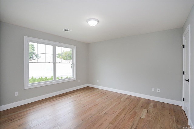 spare room featuring light wood-type flooring