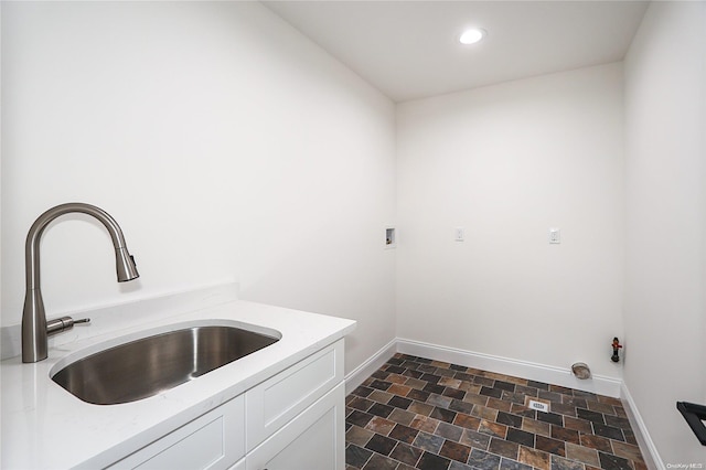 laundry area with cabinets, sink, washer hookup, and gas dryer hookup