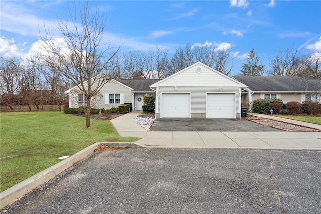 single story home featuring aphalt driveway, a front yard, and a garage