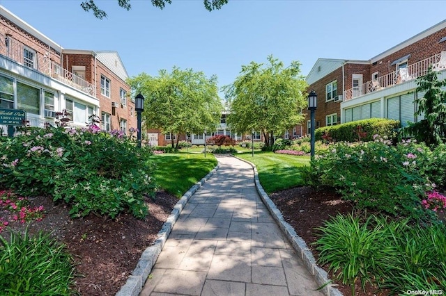 view of home's community featuring a lawn