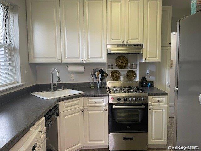 kitchen featuring sink, white cabinets, and stainless steel appliances