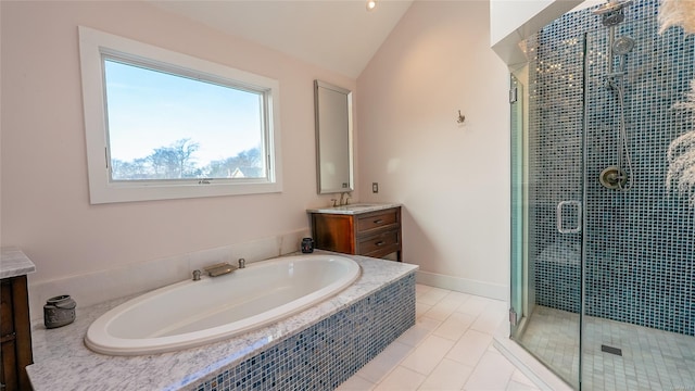 bathroom featuring tile patterned flooring, vanity, separate shower and tub, and lofted ceiling