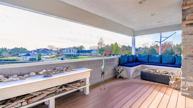 wooden terrace with an outdoor hangout area