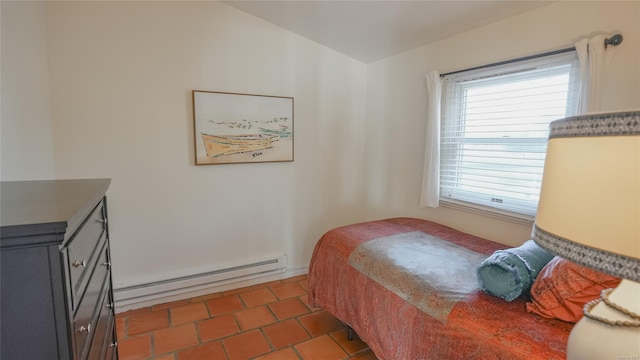 tiled bedroom with a baseboard radiator