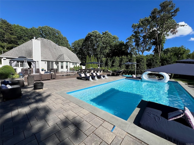 view of pool featuring a patio area