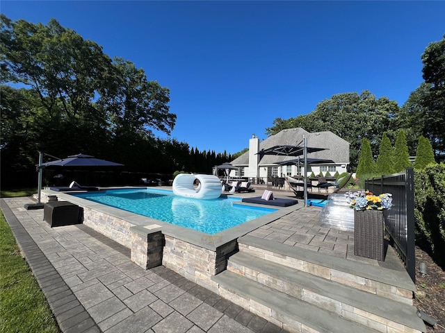 view of swimming pool featuring a patio